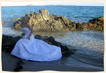Bride on rocks Bluebeards Beach St. Thomas Virgin Islands
