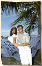 Wedding couple in hammock at Bluebeards Beach