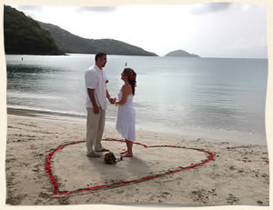 couple getting married at Magens Beach in rose petal heart
