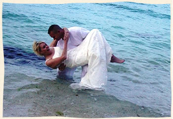 groom dipping bride island wedding