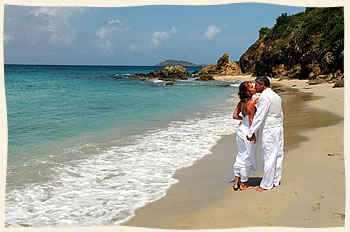 Couple kissing on the beach after saying I do at Bluebeards Beach, Limetree.