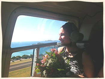 Bride on helicopter to private island wedding ceremony.