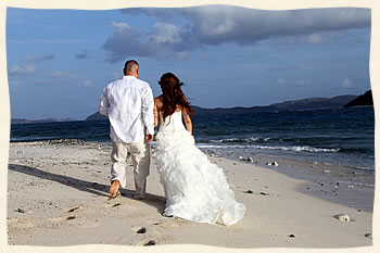 Private island beach wedding couple walking the beach.
