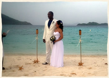 wedding ceremony at linduist beach with tiki torches