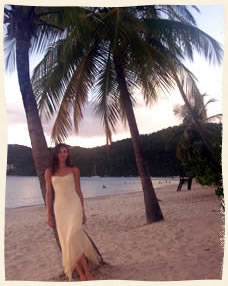 bride leaning on palm tree