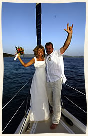 Married by sailboat captain at sea.