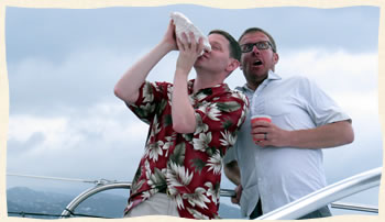 Conch blowing groomsman - sailboat wedding.