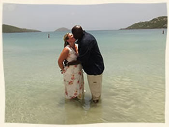 Couple kissing at Magens Beach after their vow renewal at Magens Beach