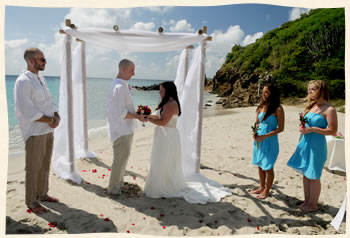 Married under bamboo arch St. Thomas beach wedding.