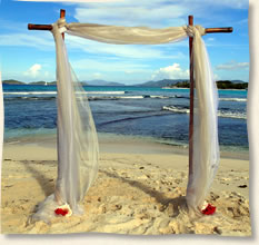 champagne fabric bamboo arch st. thomas beach wedding