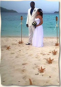 Starfish aisle with tiki torches at Lindquist Beach St. Thomas