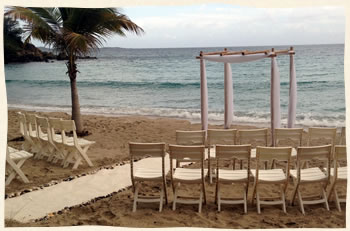 white chairs and arch set up with covers