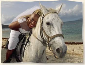 Bride on Horse after wedding with groom Lindquist Beach St Thomas  Virgin Islands