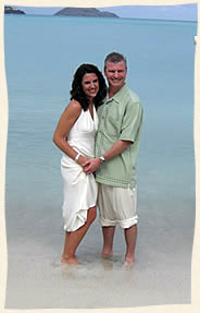 Toes in the water married at Magens Beach, Caribbean