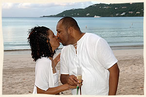 Sweet kisses at wedding on Magens Beach.