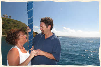 Exchanging wedding rings sailboat wedding ceremony.