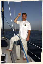 Groom waiting for bride on sailboat Virgin Islands.