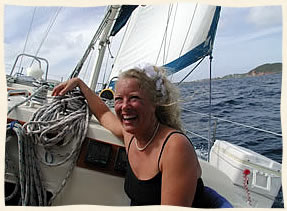 Happy bride under sail.  Island Wedding Services St. Thomas